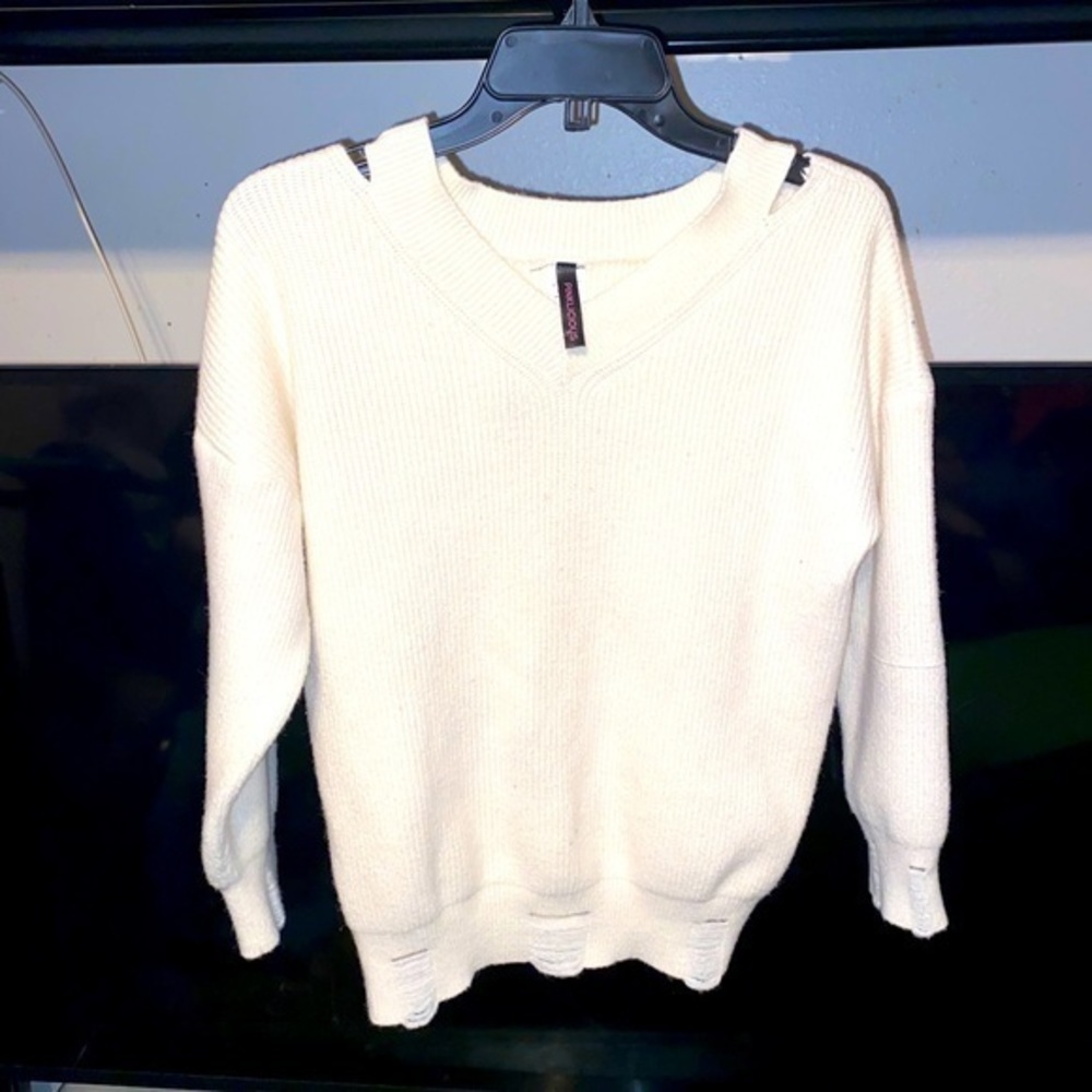 Pinkilicious distressed sweater.